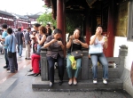 Chinese tourists eating noodles in Shanghai Old Town, China