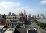 View east along the Bund to the Peace Hotel - note the thousands of tourists crowded along the promenade